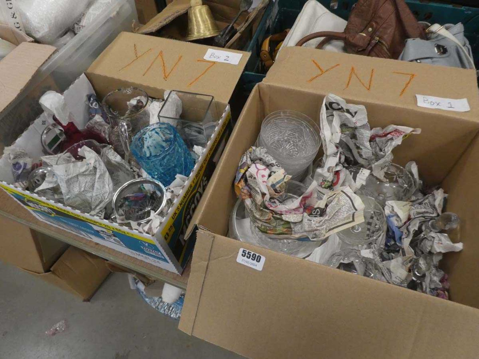 Two boxes containing sauce bottles, sundae dishes, various jugs and vases