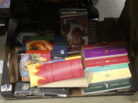 Box containing Harry Potter books plus Slam Dunk comics