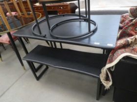 Black painted dining table with two matching benches