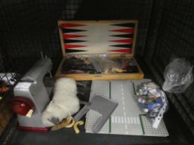 Cage containing marbles, an ornamental ram, child's sewing machine plus gaming board with chess