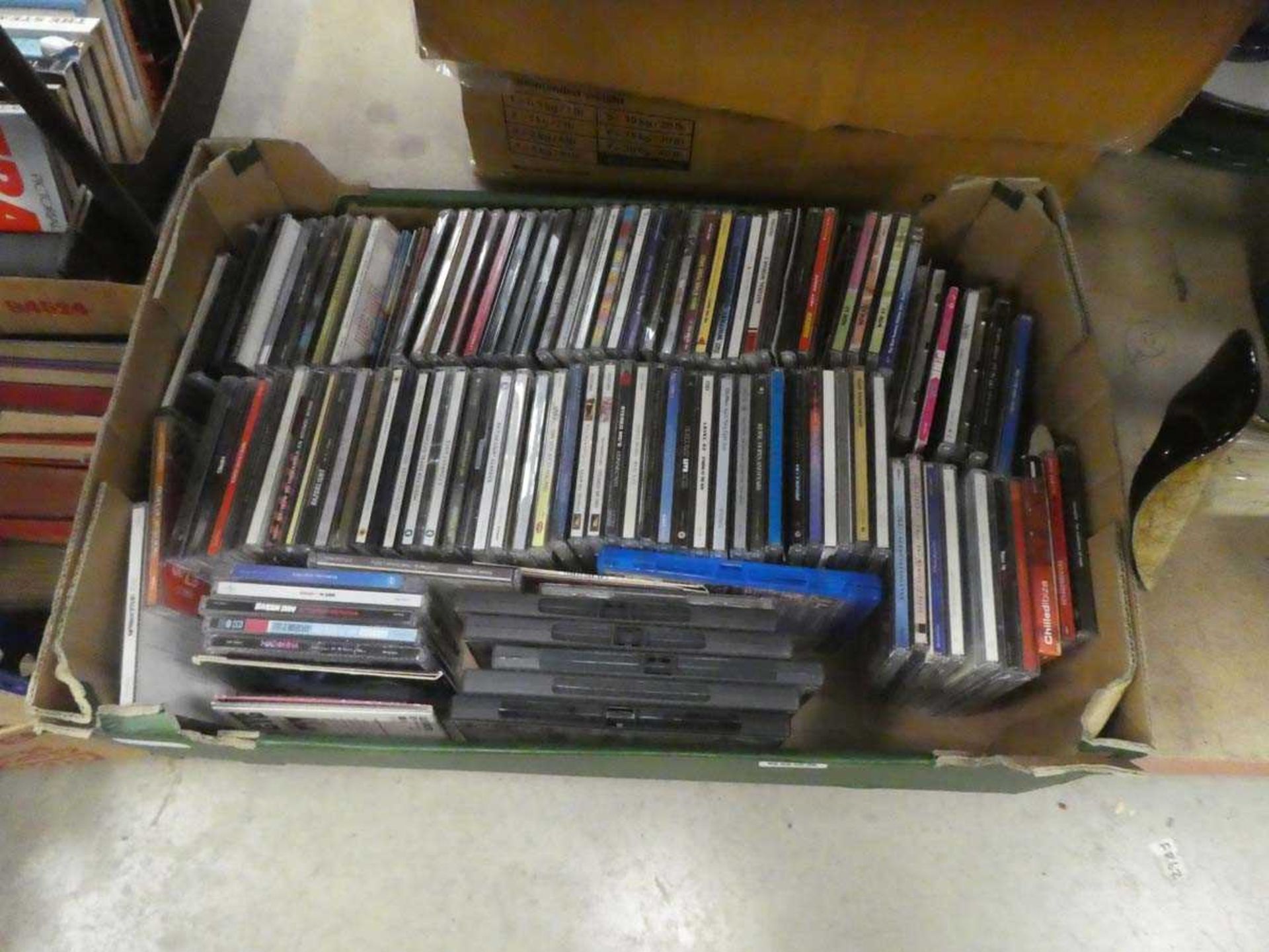 Box containing CDs and DVDs