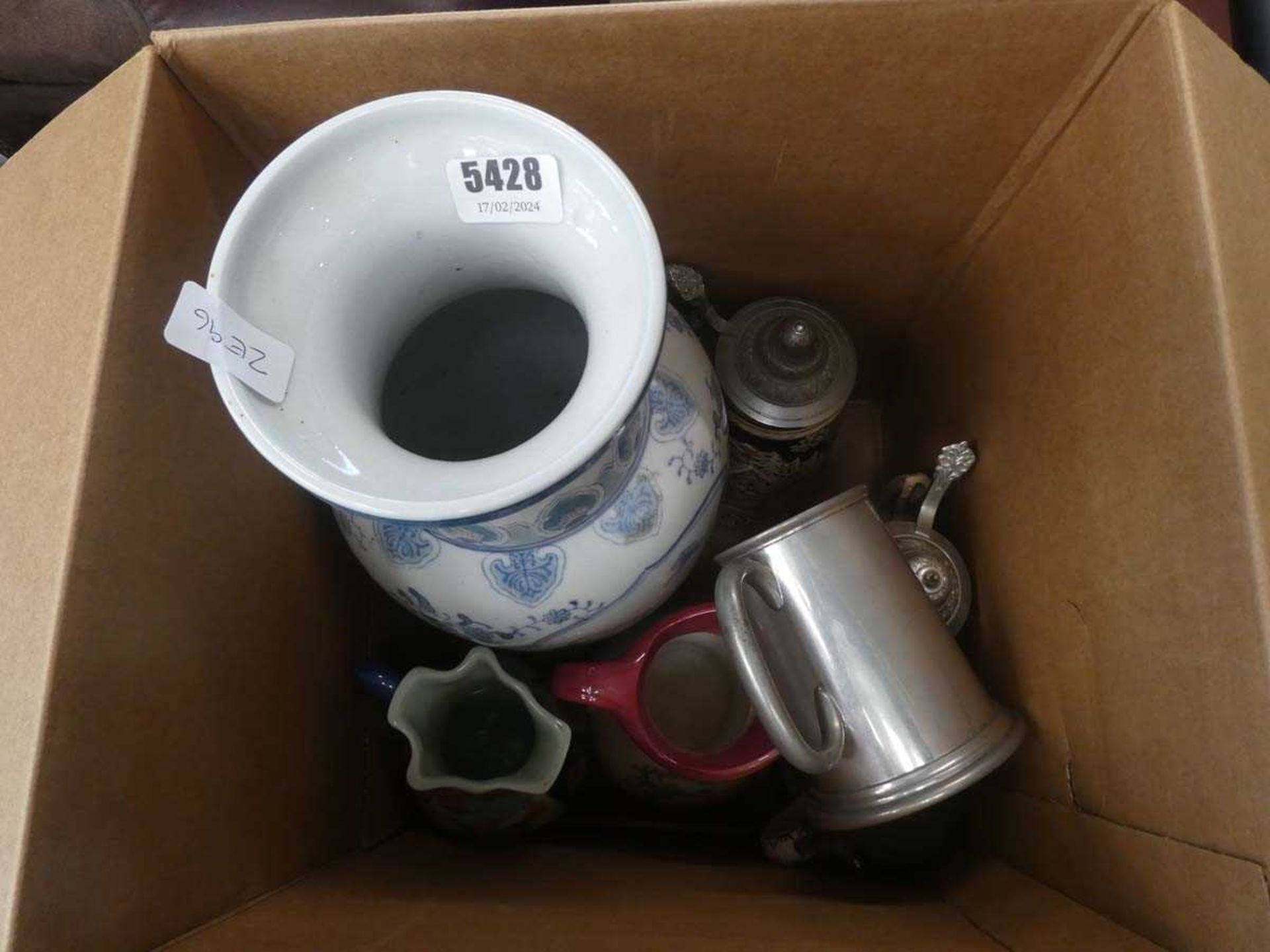 Box containing a floral patterned vase, beer steins, pewter ale mug and an emari style jug