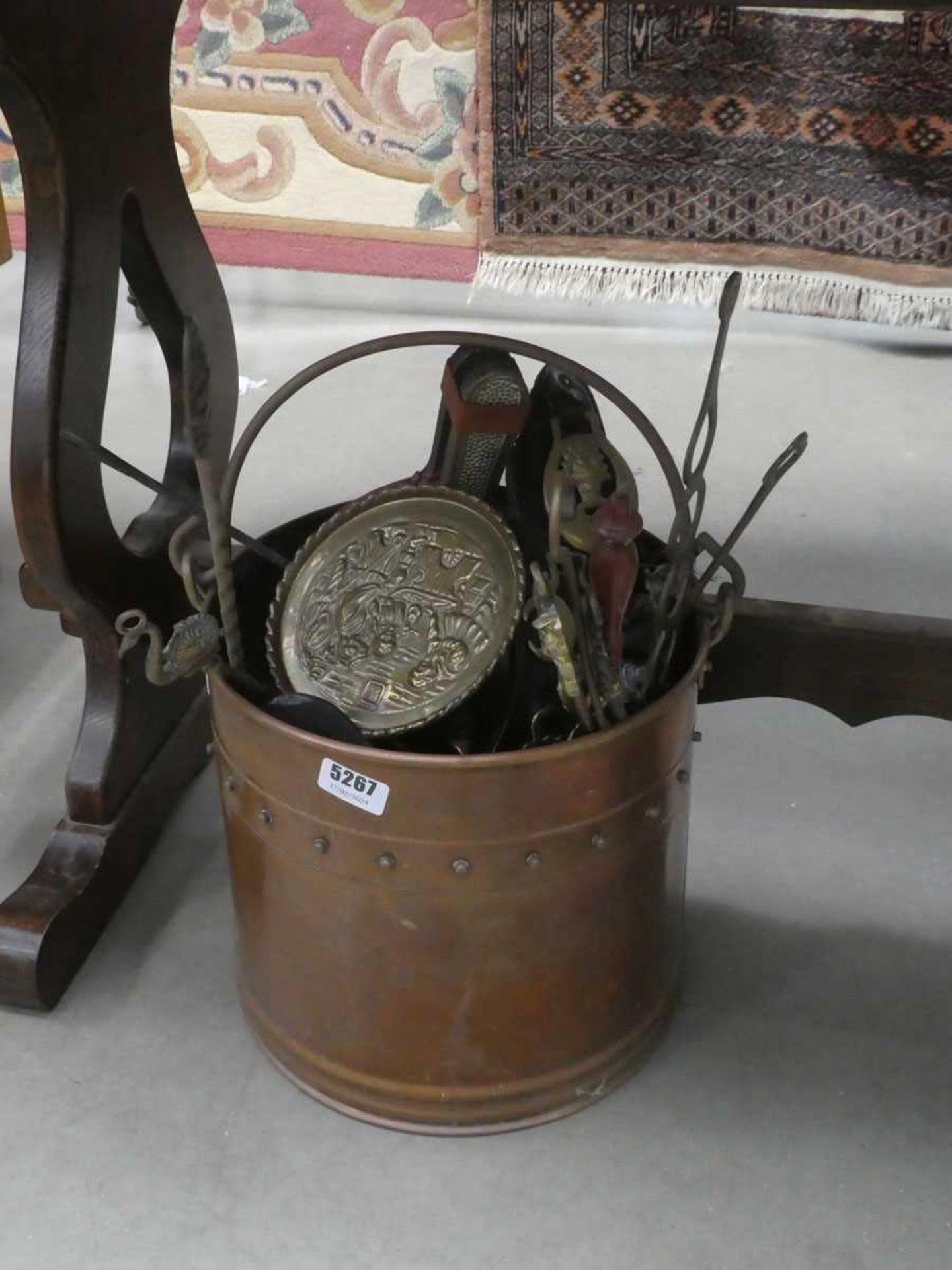 Copper coal scuttle plus horse brasses, pokers, loving spoons and bellows