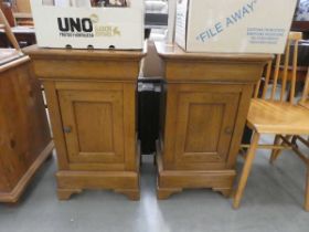 Pair of oak single door bedside cabinets