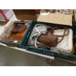 Two boxes containing binoculars, book, household ornaments and hand bags