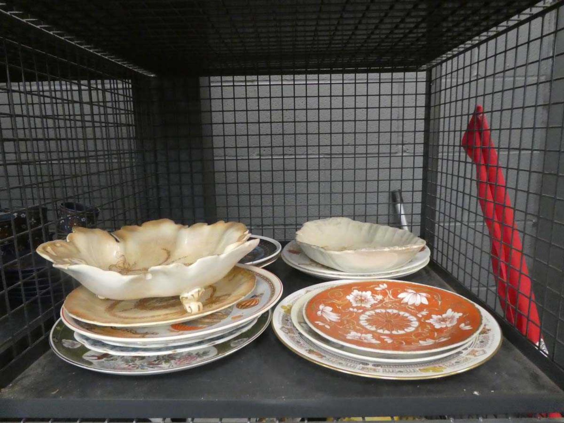 Cage containing dinner plates and dishes