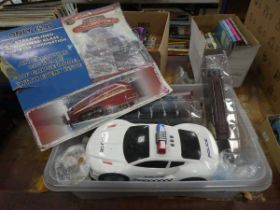 Box containing model police car plus rolling stock