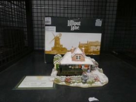 Cage containing a Lilliput Lane 'Christmas at Woody Bay Station'