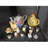 Cage containing miniature toby jugs plus novelty tea pots and general china