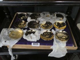 Twelve gold plated Chinese dishes