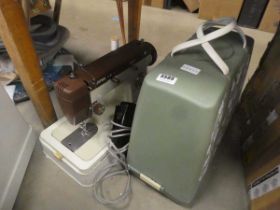 Two cased electric sewing machines