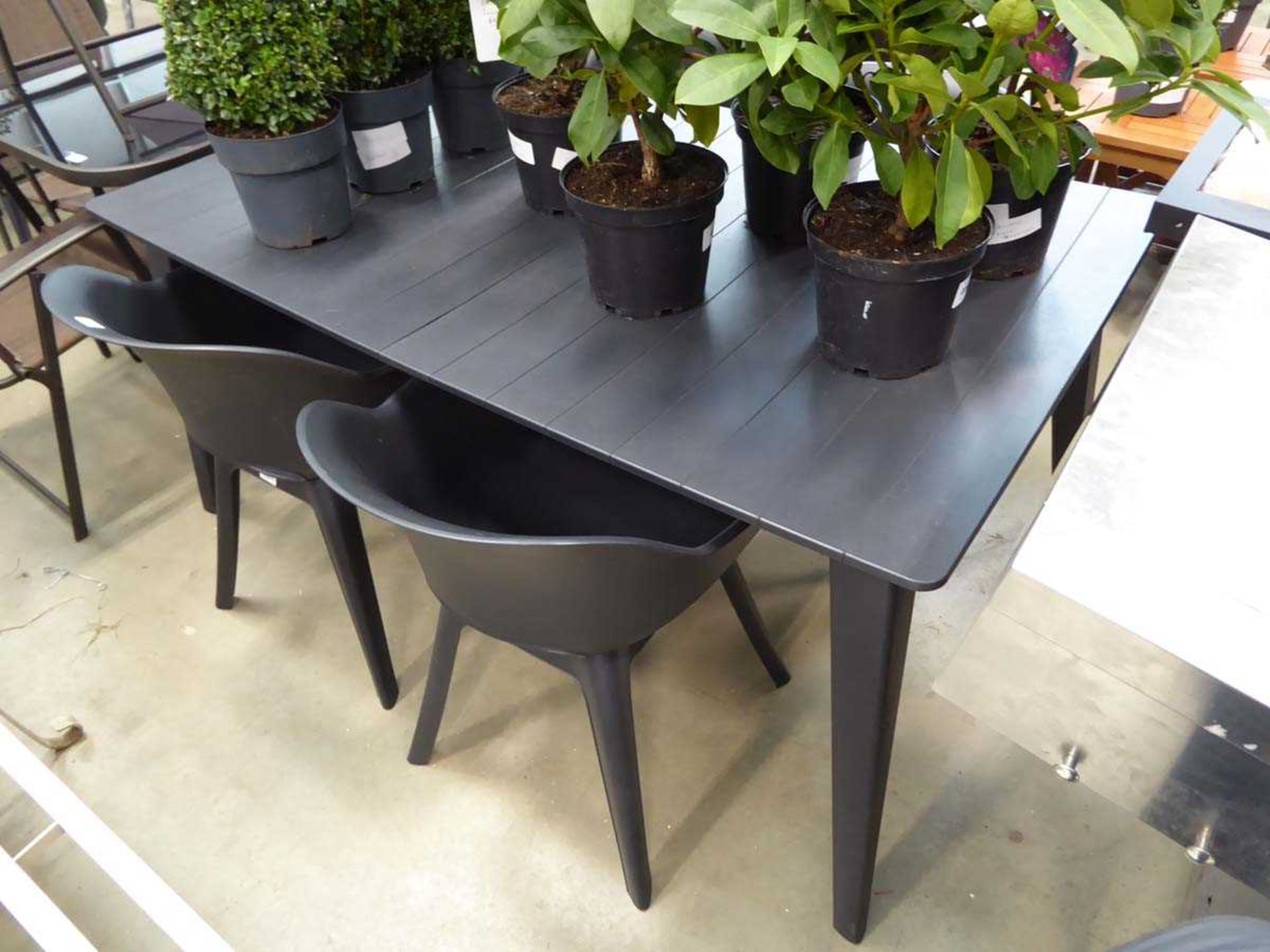 Plastic rectangular garden table with matching chairs