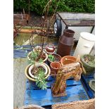 Pallet containing wooden sculptured horses head, quantity of plant pots and metal style milk churn