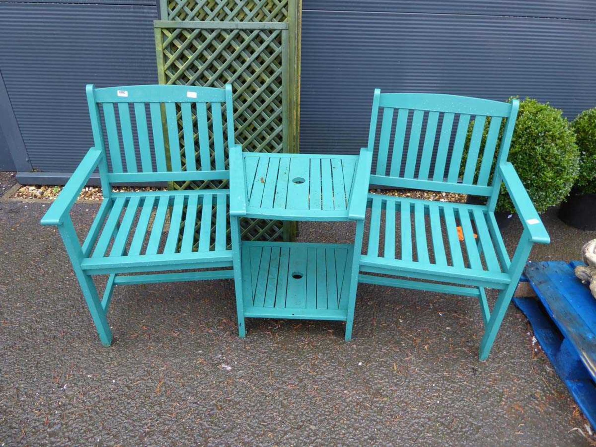 Green wooden garden love seat