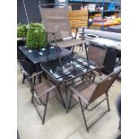 Square glass topped brown table with 4 fold-up chairs