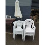 Oval plastic garden table and qty of plastic chairs