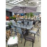 Rectangular garden table with parasol, six chairs, side table and two footstools