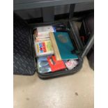 4 suitcases with a quantity of novels and reference books