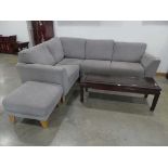 Grey fabric 2 section corner suite and a matching footstool