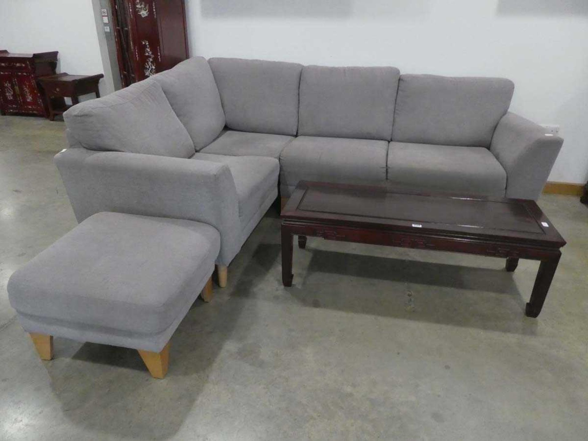 Grey fabric 2 section corner suite and a matching footstool