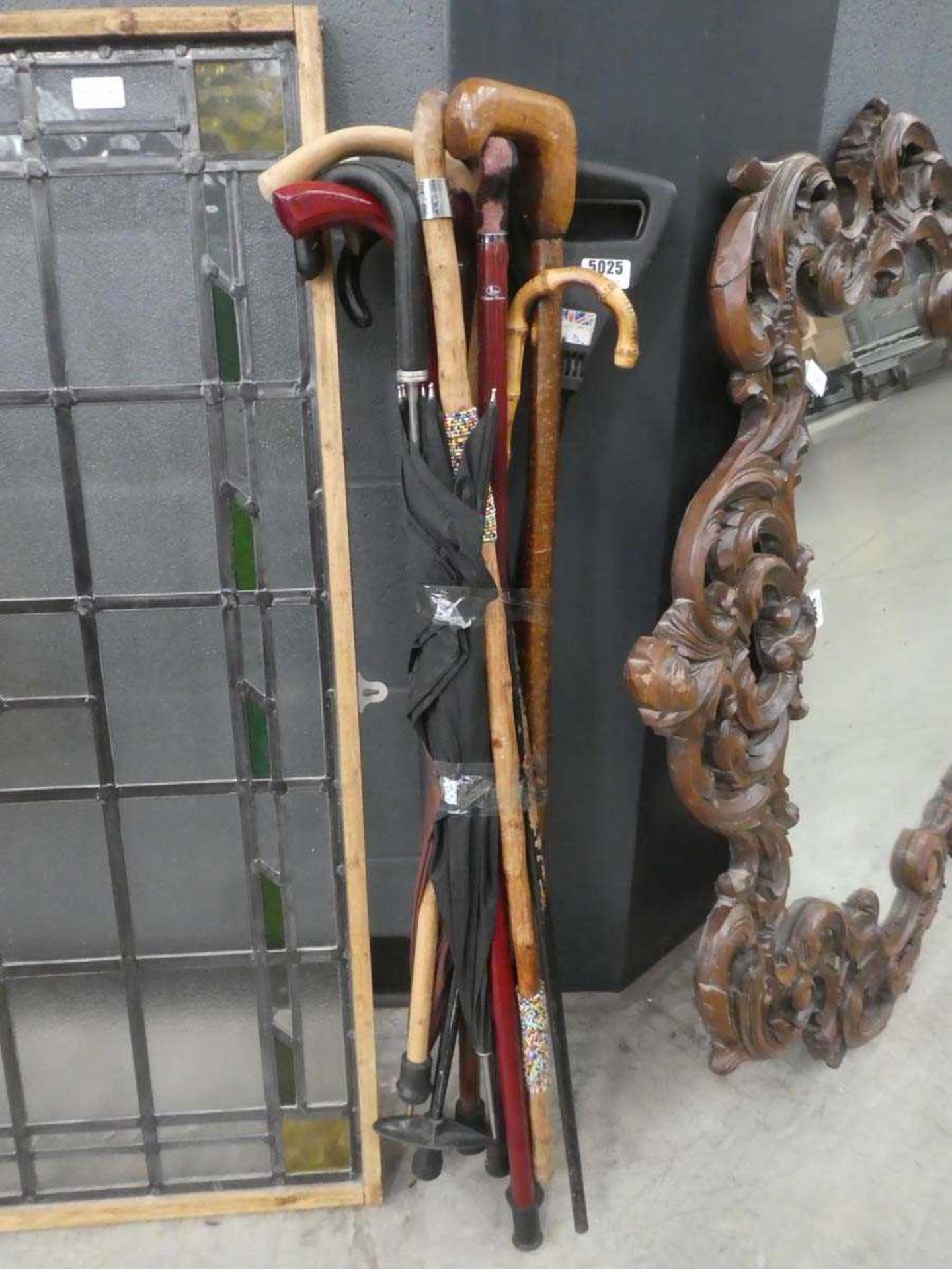 Bundle of walking sticks, umbrella etc