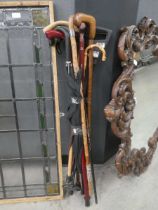 Bundle of walking sticks, umbrella etc