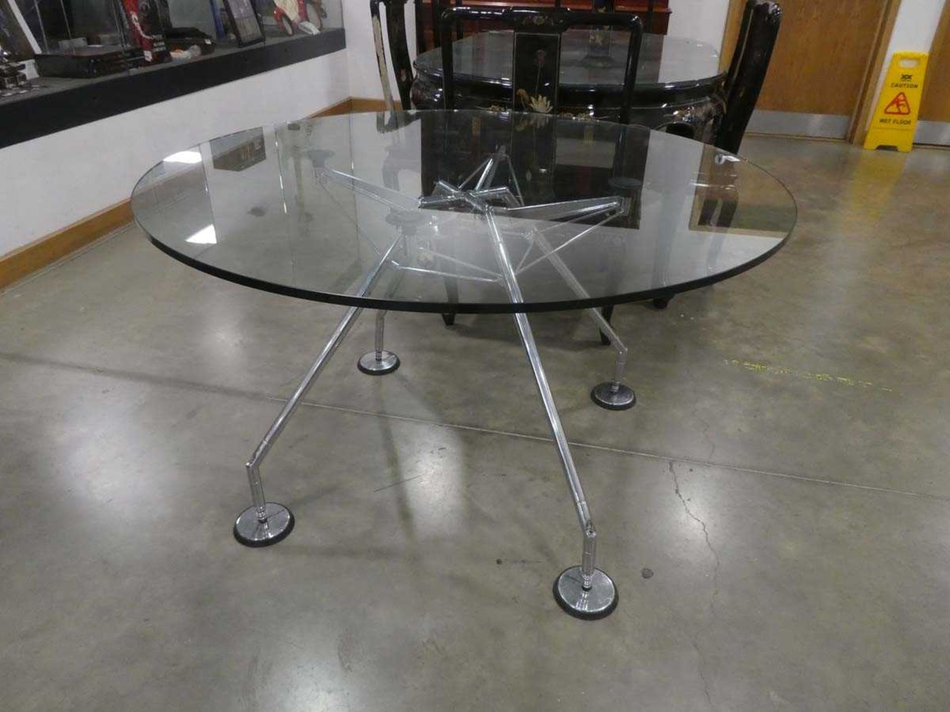 Lord Norman Foster for Tecno, a 'Nomos' circular meeting table, the glass surface resting on a