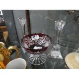 Pair of clear glass candle sticks and a ruby and clear glass dish