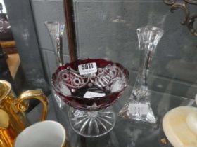 Pair of clear glass candle sticks and a ruby and clear glass dish