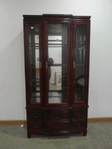 Oriental export redwood glazed display cabinet with drawers under