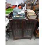 Glazed double door bookcase with encyclopedia Britannica plus other loose books