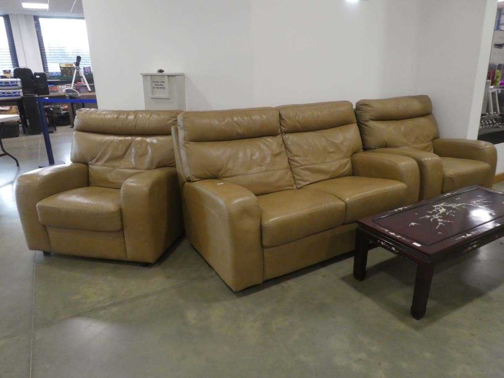 Toffee coloured leather finish 2 seater sofa and a pair of matching armchairs