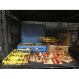 Cage containing boxed and loose diecast vehicles