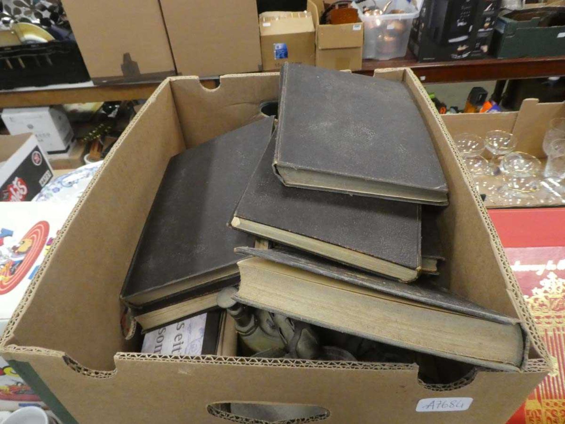 2 boxes containing reference books and blow torches