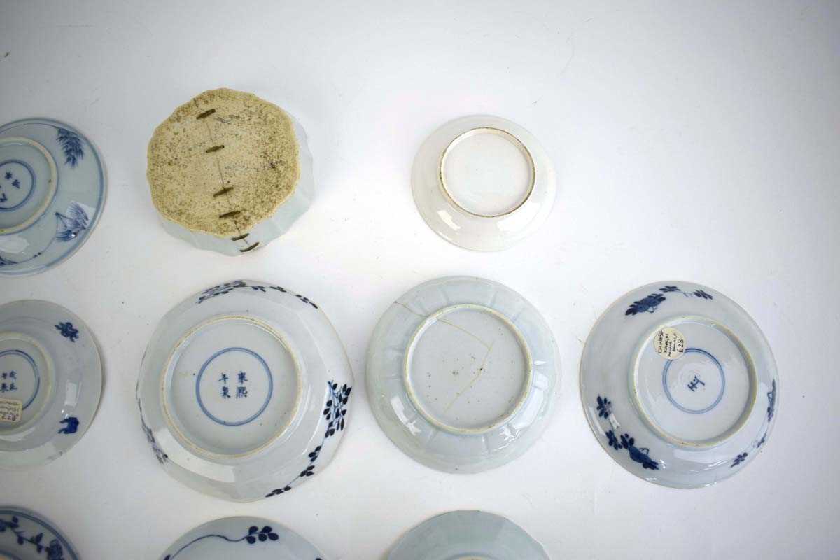 Eleven 18th century and later Chinese blue and white dishes and saucers including examples decorated - Image 7 of 8