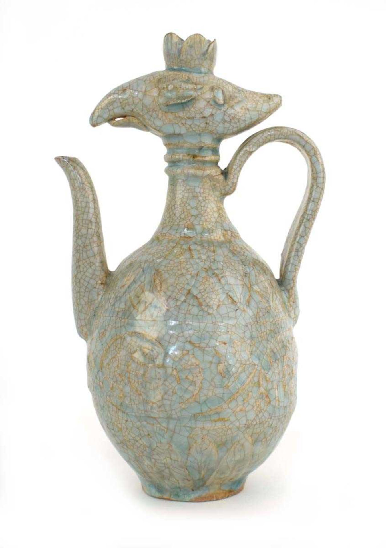 A Chinese celadon teapot with stylised bird's head finial, h. 22.5 cm *from the collection of