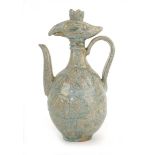 A Chinese celadon teapot with stylised bird's head finial, h. 22.5 cm *from the collection of