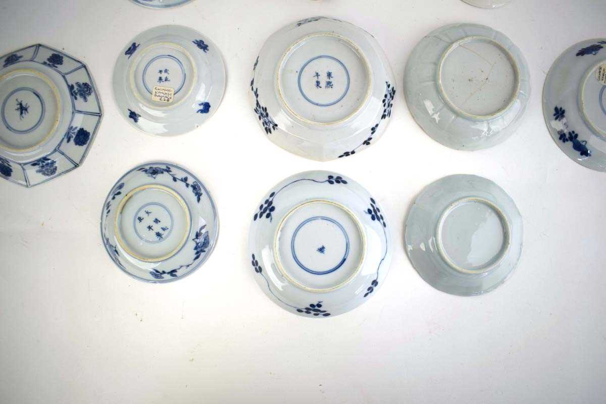 Eleven 18th century and later Chinese blue and white dishes and saucers including examples decorated - Image 8 of 8