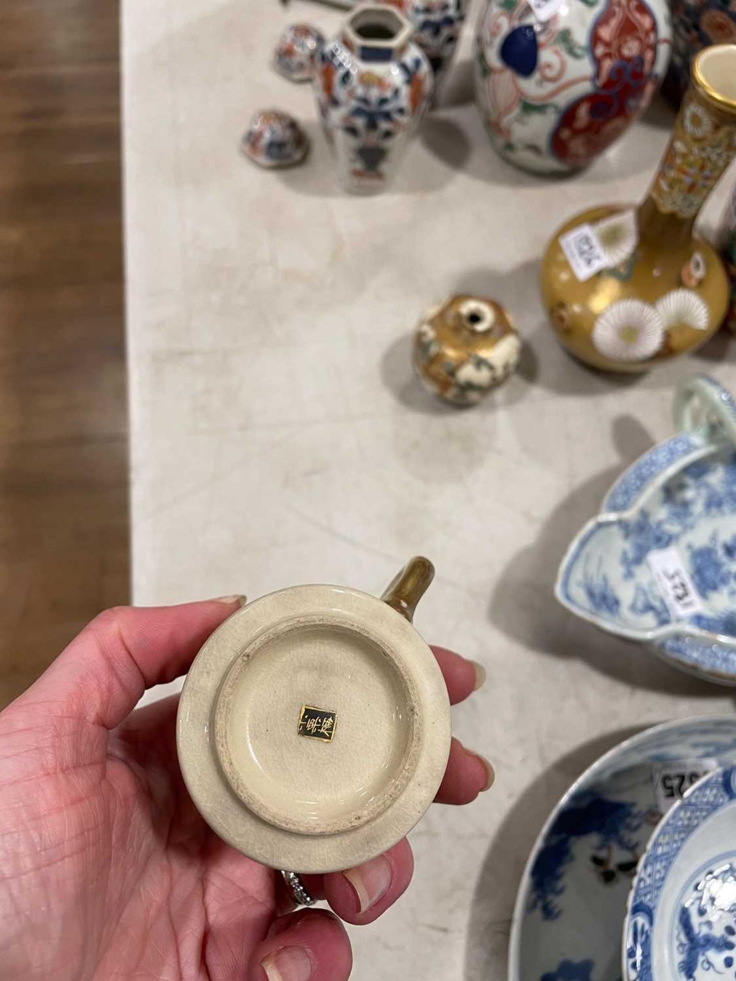 A Japanese satsuma bowl of flowerhead form, centrally decorated with peacocks within a landscape, - Image 13 of 41