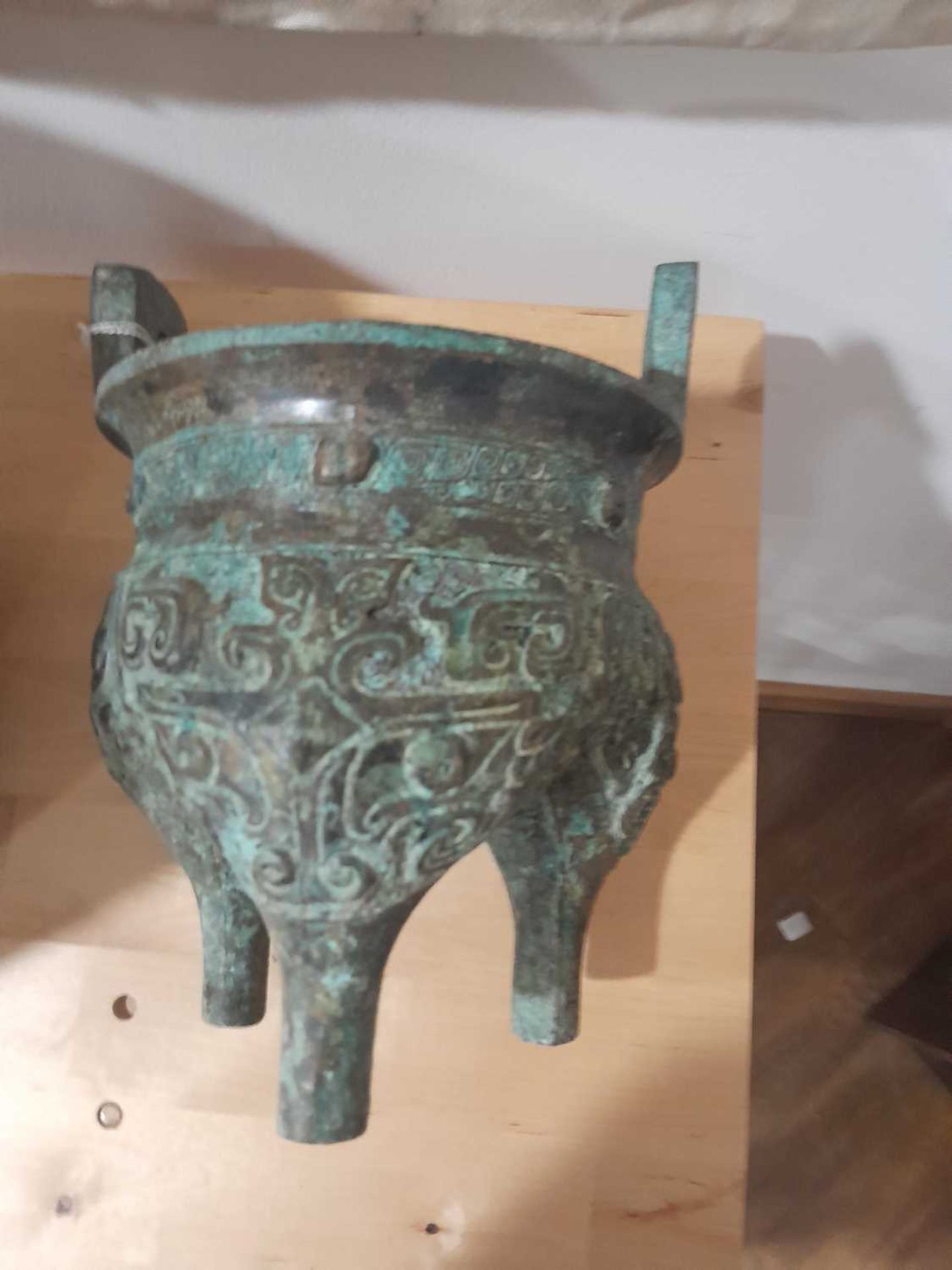 A Chinese green patinated bronze incense burner of archaic form, the triform base decorated with - Image 12 of 29