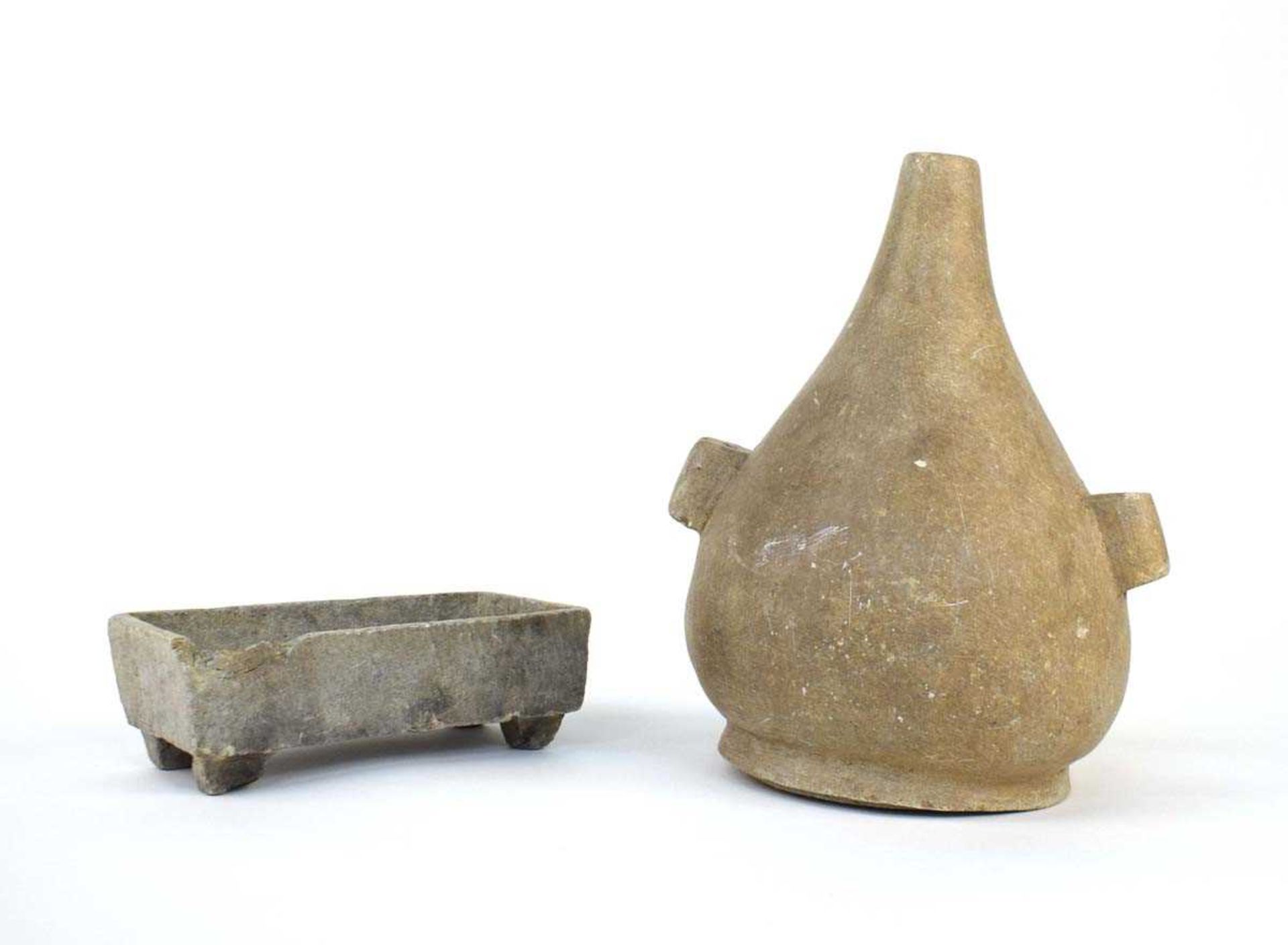 A Chinese carved soapstone vessel of slender ovoid form, h. 25.5 cm, a similar rectangular trough,