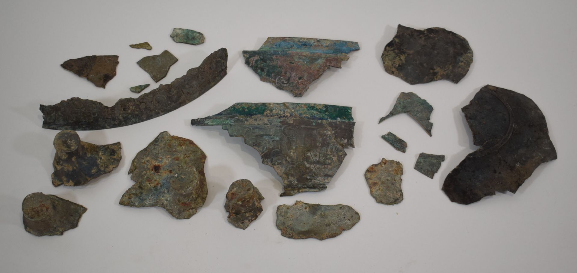 A group of Chinese brown patinated brown shards from an incense burner, with relief decoration and - Image 2 of 2