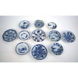 Eleven 18th century and later Chinese blue and white dishes and saucers including examples decorated