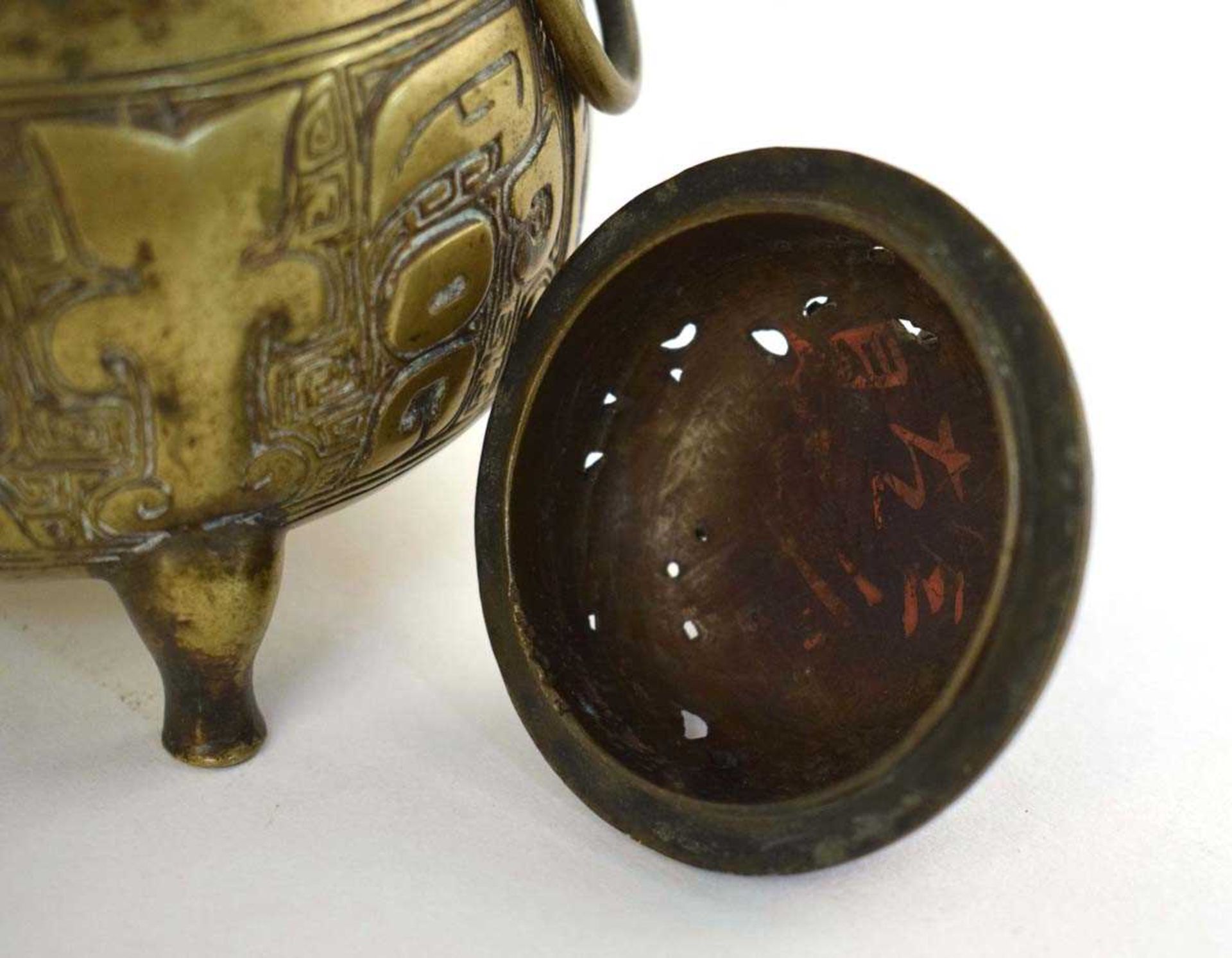 A 19th century Chinese bronze incense burner decorated with key motifs and having three ring handles - Image 3 of 33