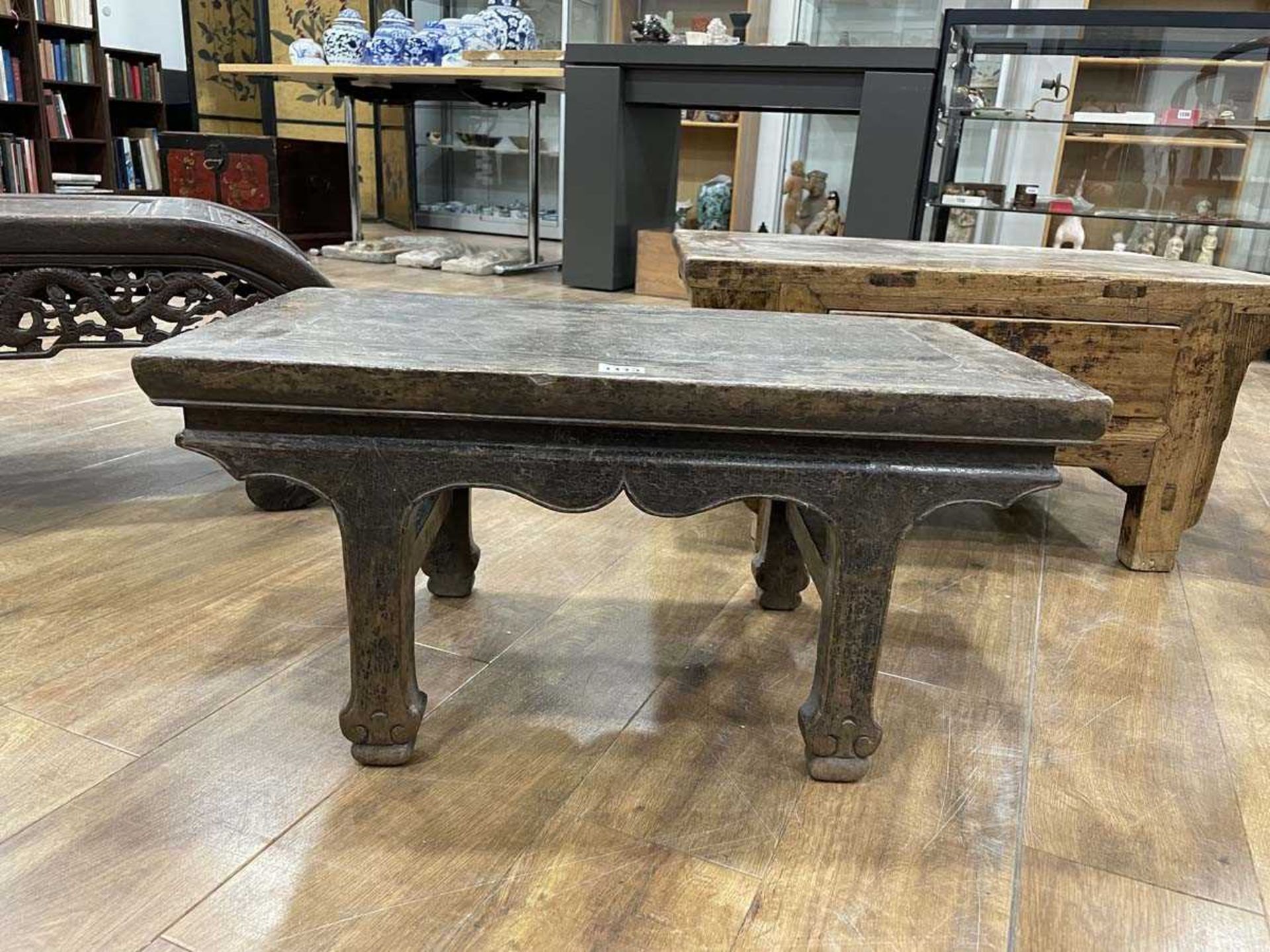 A Chinese low elm side table, the surface over a frieze on four shaped legs, 64 x 35 x 31 cm, - Bild 3 aus 15