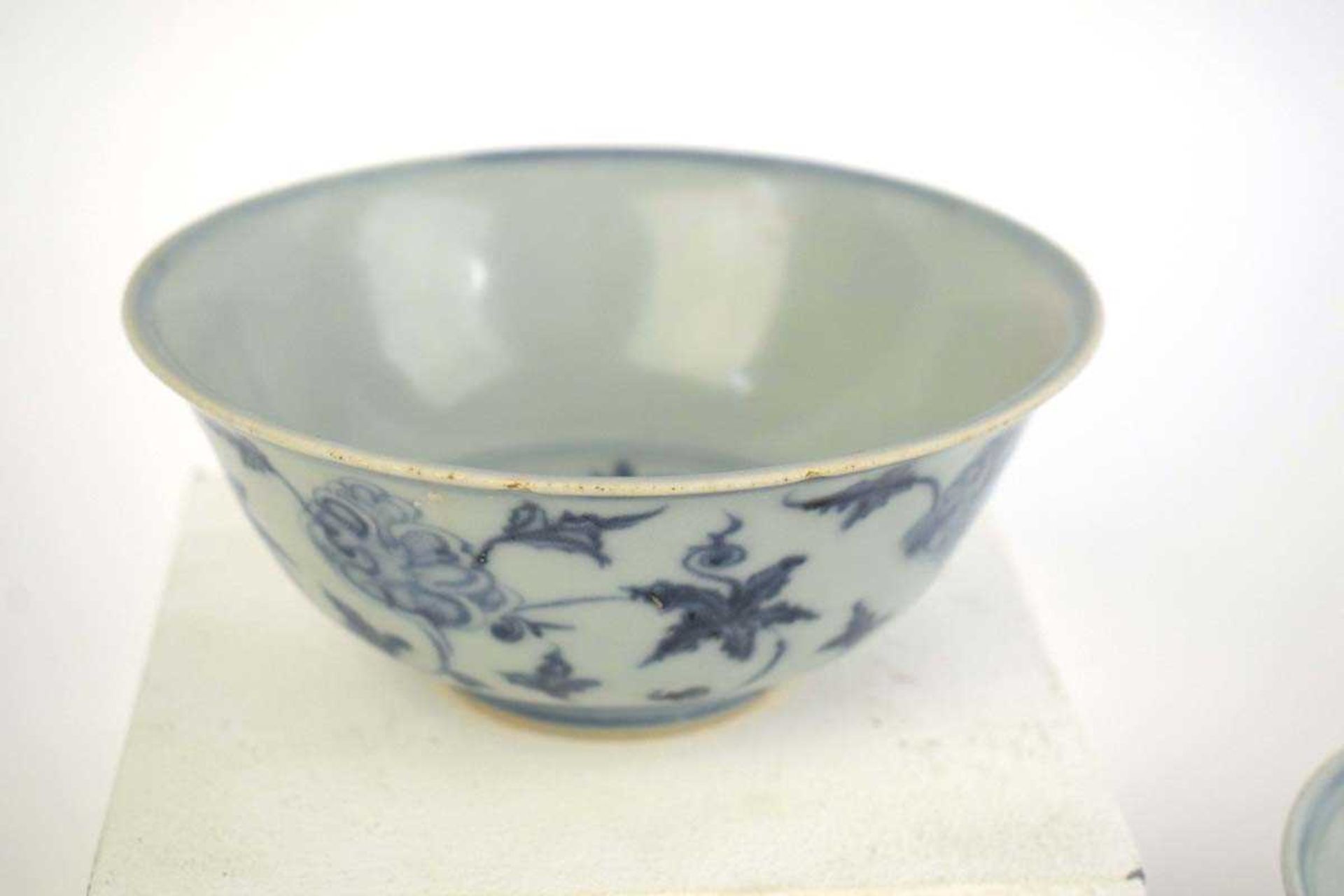 A Chinese blue and white bowl of flared form, externally decorated with scrolls of stylised - Image 4 of 22