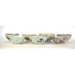 A Chinese bowl externally decorated in coloured enamels with a processional scene and centrally