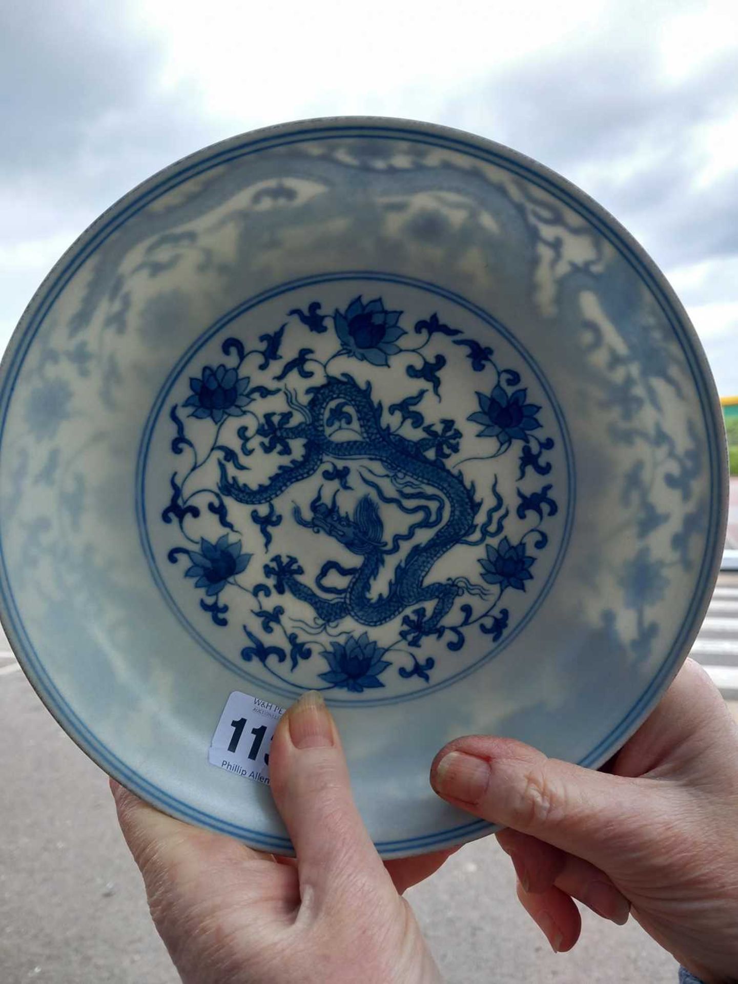 A Chinese blue and white shallow dish, centrally decorated with a dragon and lotus flowers, pseudo - Image 11 of 31