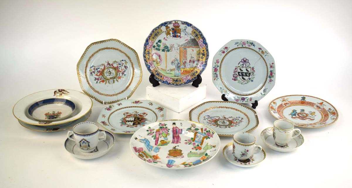 A Chinese Export armorial dish, decorated in coloured enamels with traditional figures and the (?)