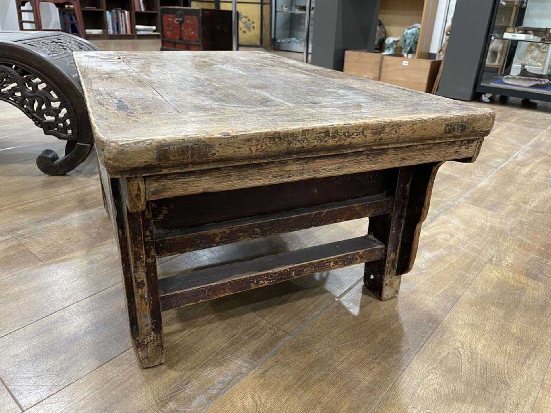 A Chinese low elm side table, the surface over a frieze on four shaped legs, 64 x 35 x 31 cm, - Bild 14 aus 15